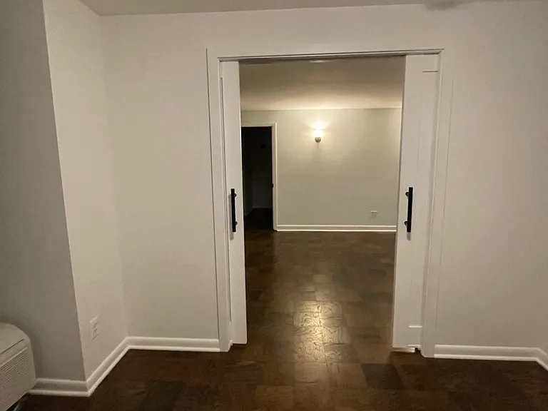 View from inside the second bedroom to the living room.
