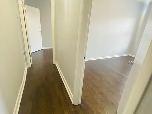 This is the unit after rehab! New Floors - Brand New Stainless Steel Appliances - New Bathrooms - New Paint (Light Blue)