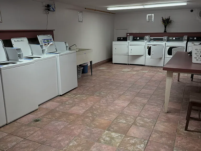 Shared coin op laundry in the basement