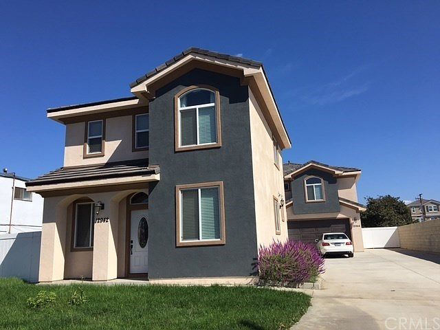 12942 Louise St., is in the front and 12944 Louise St., is i