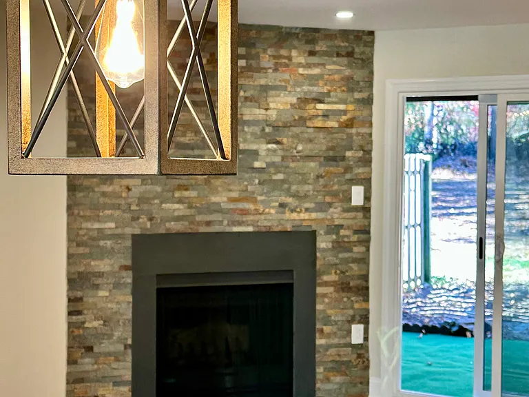 Brick fireplace centerpiece _ Cozy winter ambiance _ Warm, inviting living space