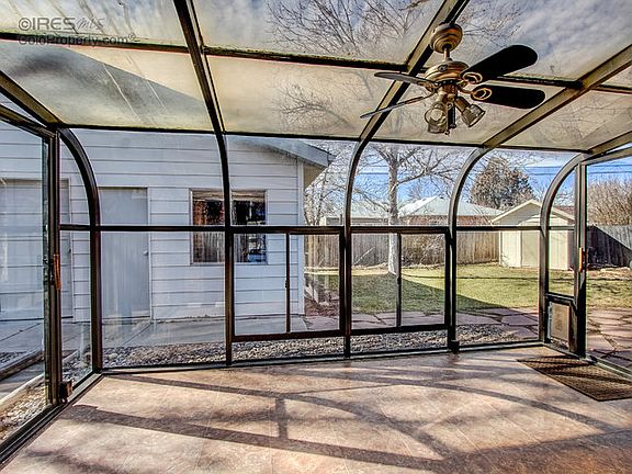 Ceiling fan in sunroom with sink