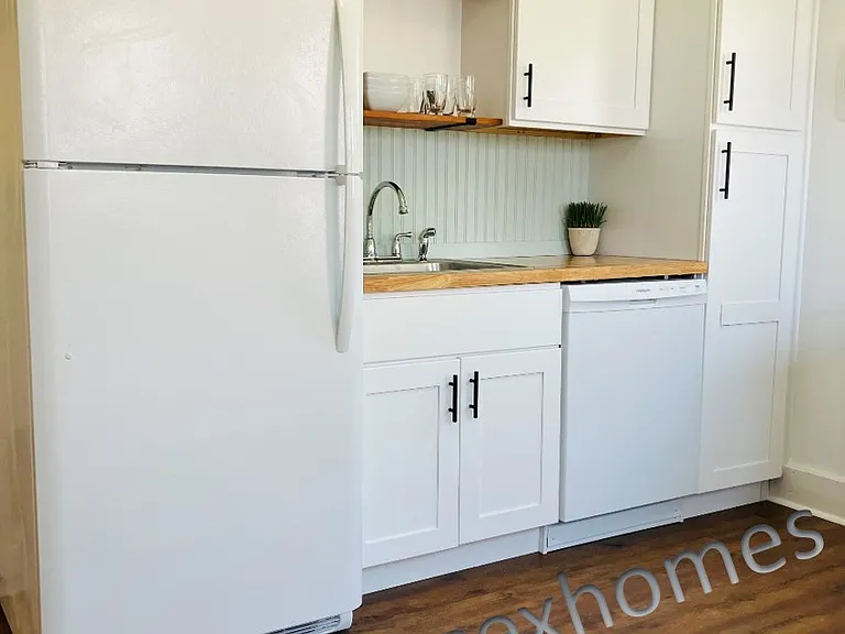 Bright and cheery kitchen with new slow close cabinets and appliances.