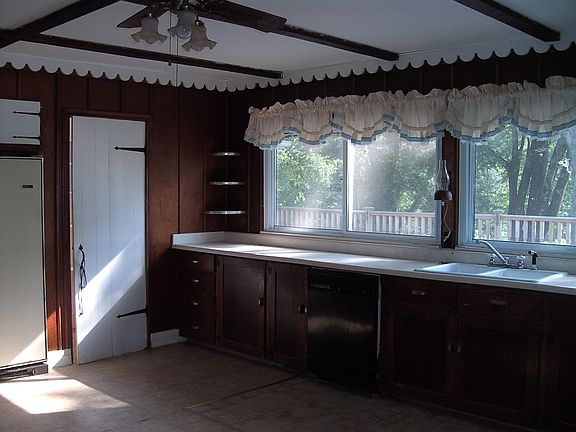 View of kitchen including fridge and pantry