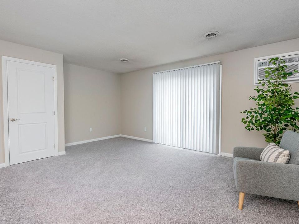 Spacious living rooms feature plush carpeting or wood-style flooring and sliding doors to your private balcony in select homes.