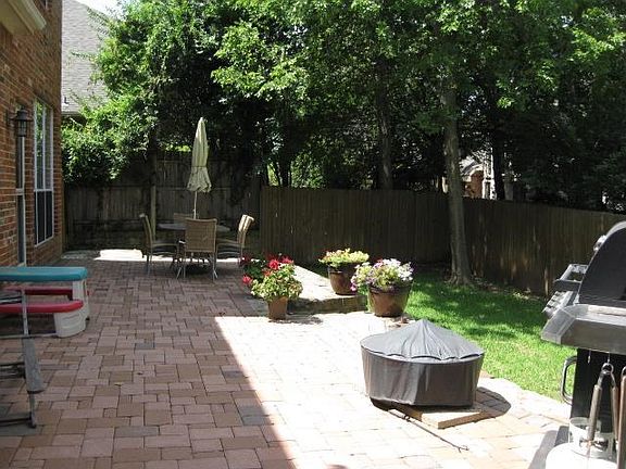 ANOTHER VIEW OF PATIO AREA AND BACKYARD