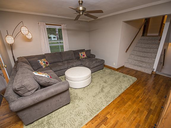 Refinished hardwood floors highlight the center of the home.