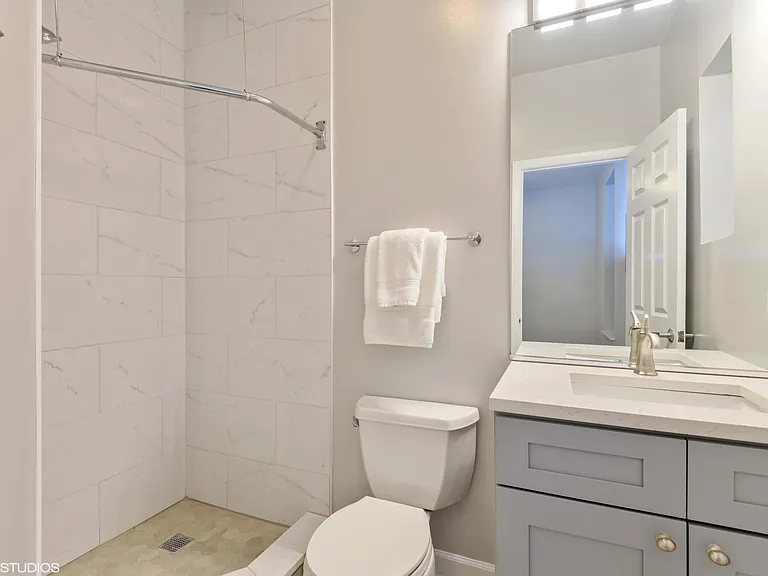 Main floor renovated bathroom attached to bedroom