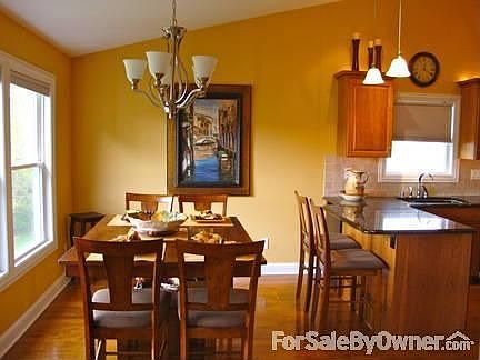 Breakfast bar has a beverage fridge : Eating area will hold a generous table--triple window