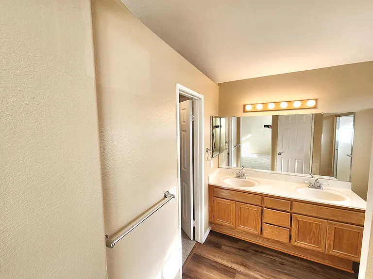 Primary bathroom with dual sinks.