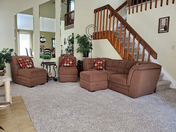 Living room area, facing the fireplace. Stair case goes to 2nd floor HUGE master suite and loft area. It would be great for a home office of reading nook.