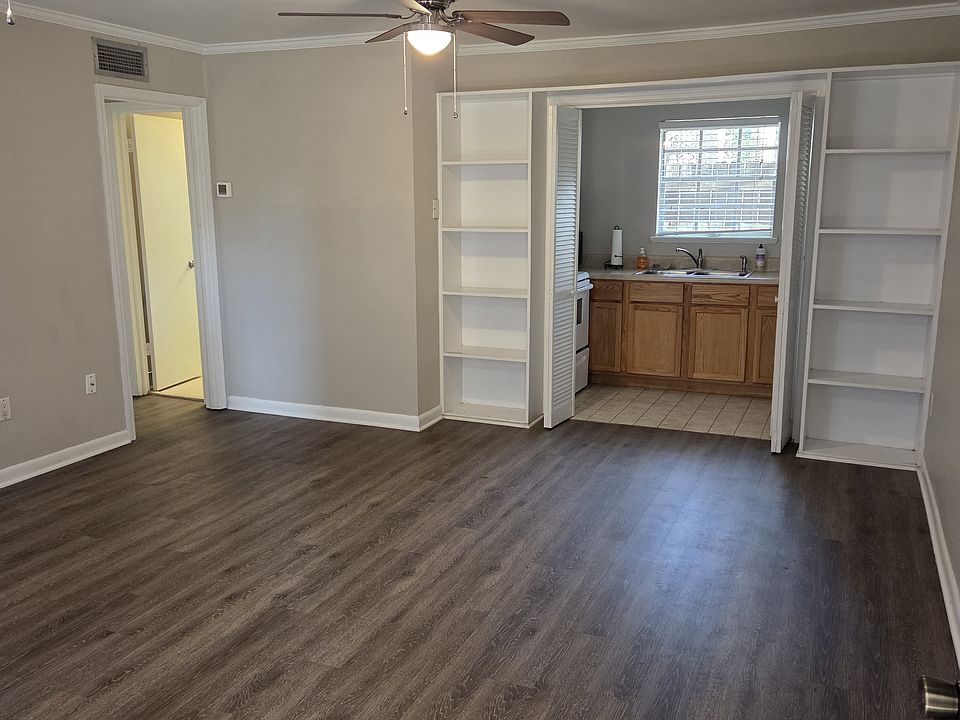 Main Rm w/2 ceiling fans. Kitchen in Background
