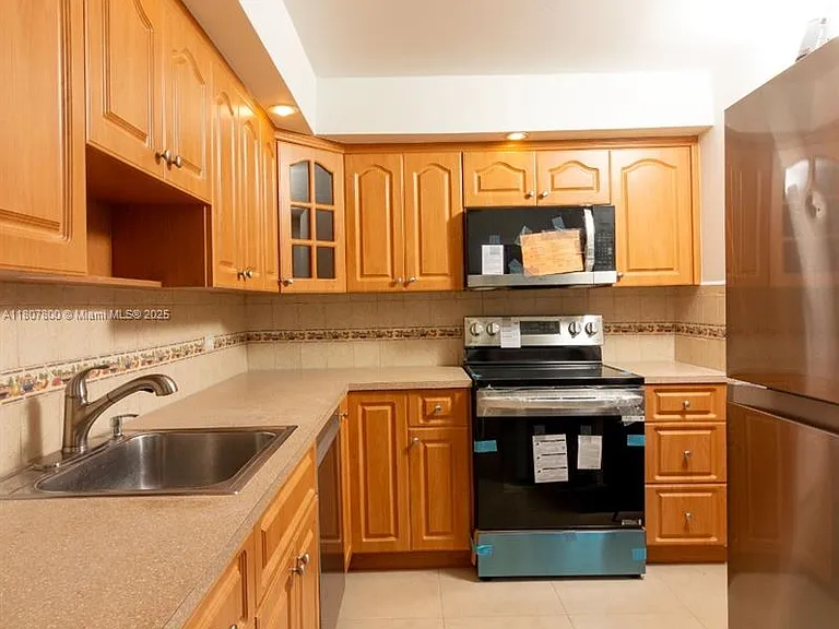 447 NE 195th St #217 — Photo 14