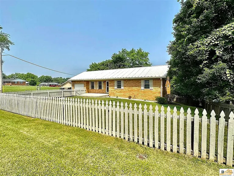 Looking for a picture-perfect rental? Look no further! This charming house with a white picket fence is nestled in a peaceful neighborhood, offering a serene escape. Step outside and enjoy the spacious fenced yard. It's time to make unforgettable memories