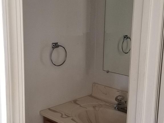 Vanity of the half bath. Toilet to the left.