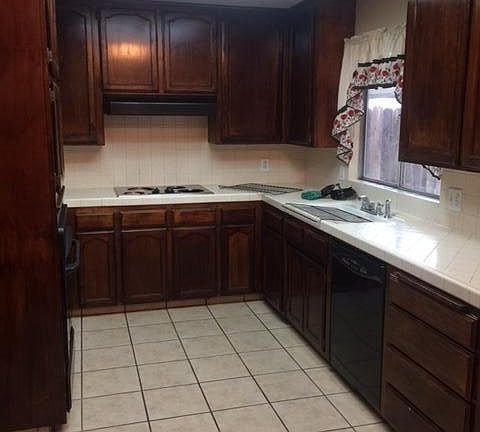 Kitchen comes with stove and dishwasher.