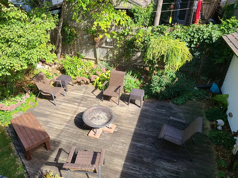 Beautifully landscaped backyard deck area is shared with owner.
