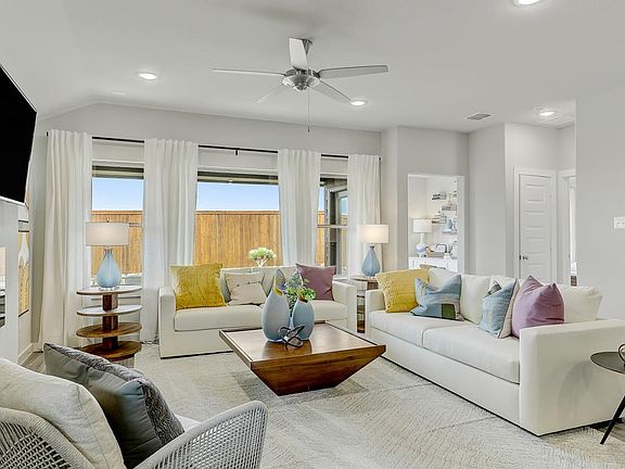 Living room in the Oscar home plan by Trophy Signature Homes - REPRESENTATIVE PHOTO