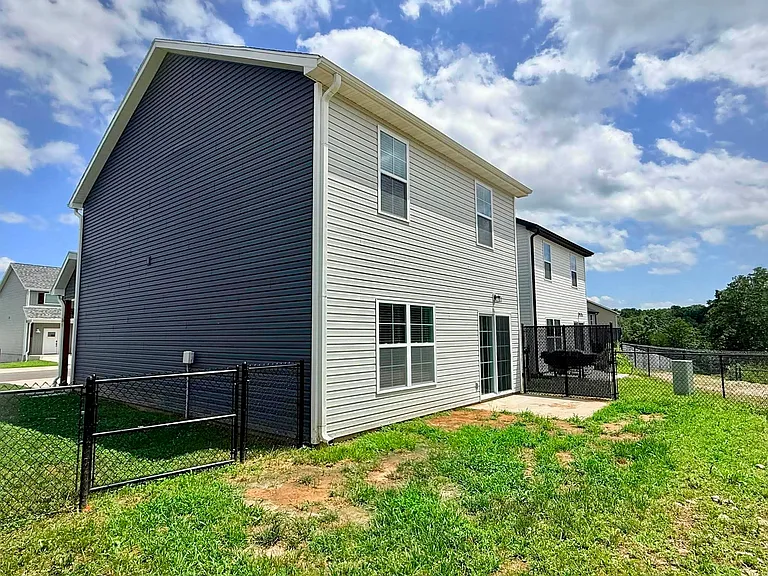 Back exterior fenced-in yard