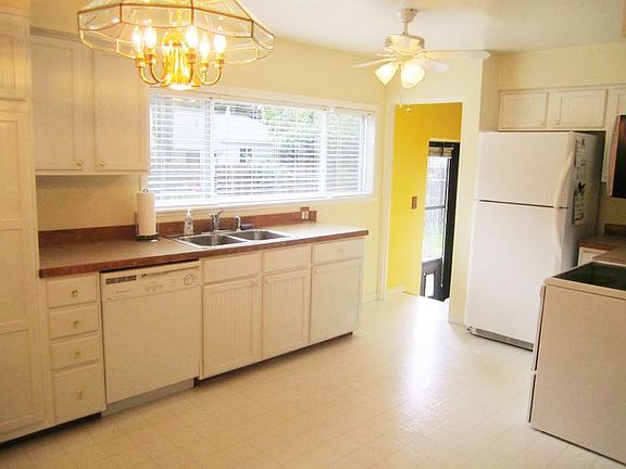 The newer kitchen is light, bright and offers a newer sizable window and abundant work space and storage. Also, the convenient back deck is just steps away.