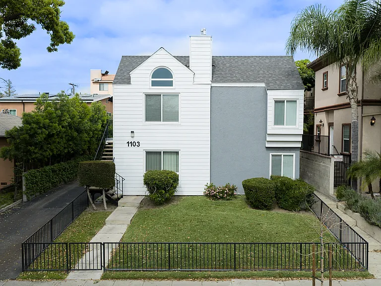 Small front yard with the only access to the upstairs unit D.