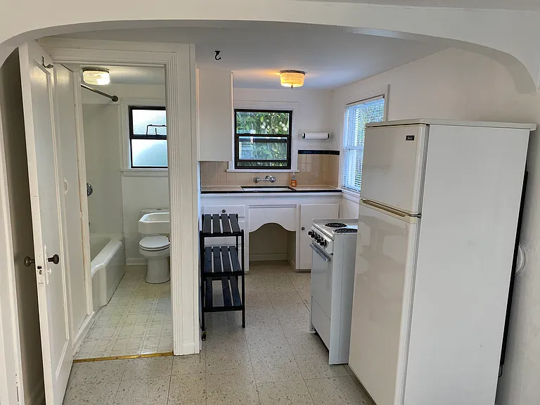 Small galley kitchen and full bath (includes deep cast iron tub)