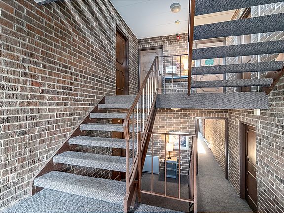 Common area.  Door to Unit A is down a few stairs and on left.  Laundry room door is on right.  Once