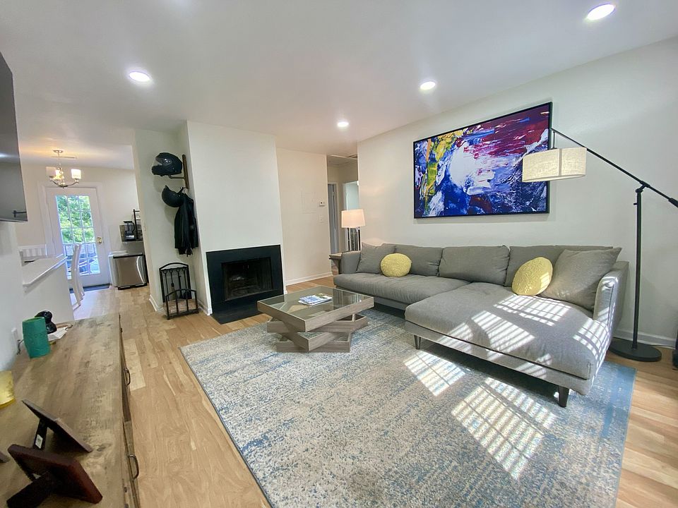 Large living room. Open to dining area, kitchen, and balcony.