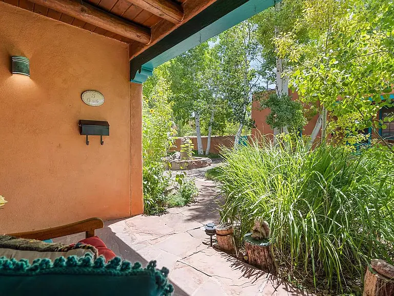 Front porch overlooking the common area, shared by other units.