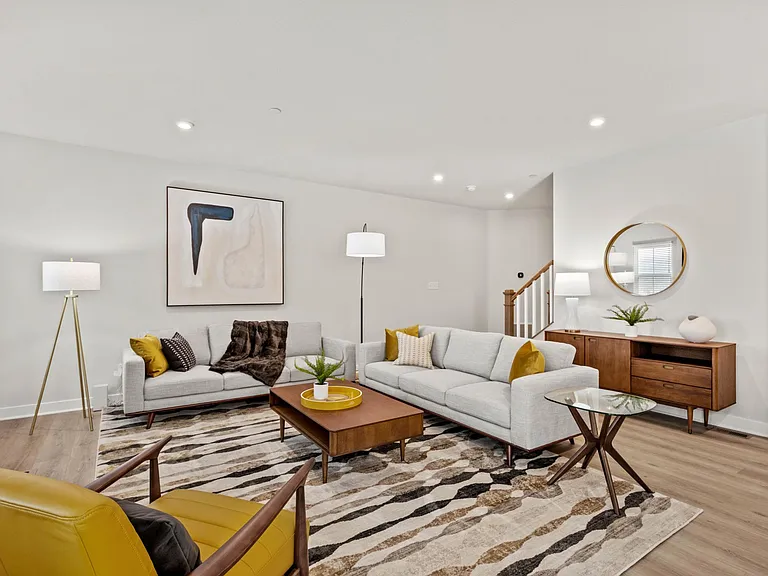 Modern lighting and fixtures add the finishing touches to the open concept great room