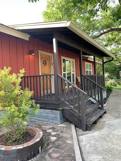 The covered front porch is shaded by a huge old pecan tree. Great for sitting.