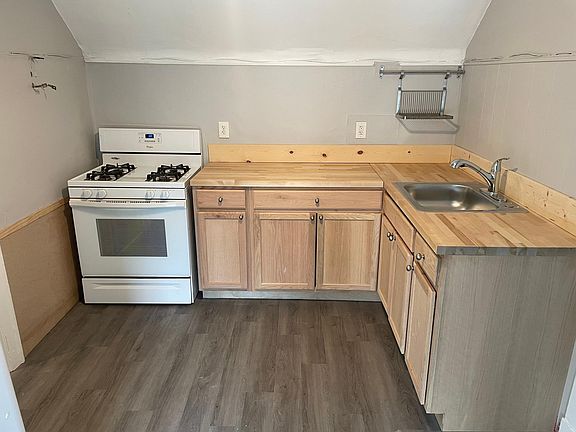 New kitchen countertops, faucet, and cabinets