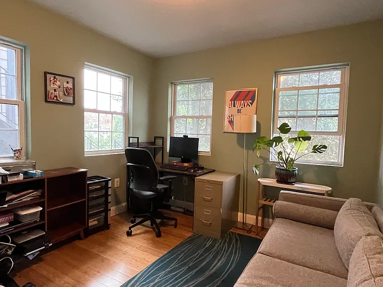Office overlooking backyard. Not all furnishings seen here will be present.