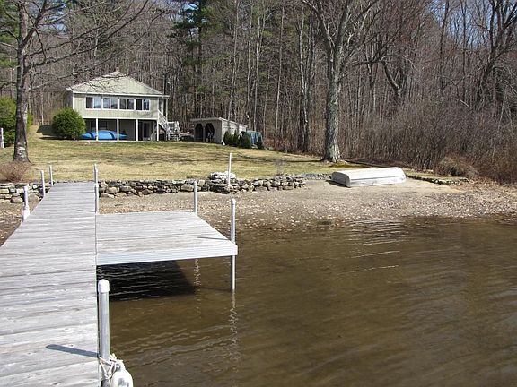 View of backyard and backside of the house from the dock