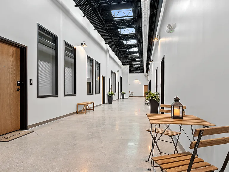 Our halls do more than connect- you can lounge, laugh, sip, and stay. Sunlight included.