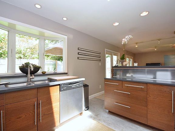 Alternate view of kitchen. Notice appliance storage on the Island. Recessed lighting.