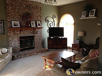 Relax with the warm fireplace and arched windows!