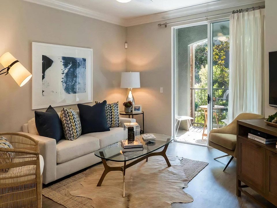Spacious Living Room with Sliding Doors and Wood-Style Flooring