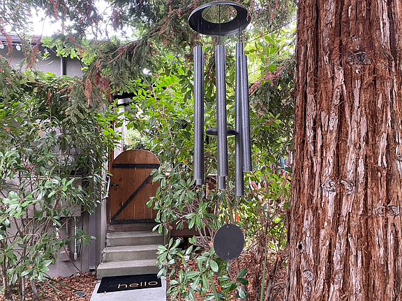 Three steps up to the cottage deck and front door
