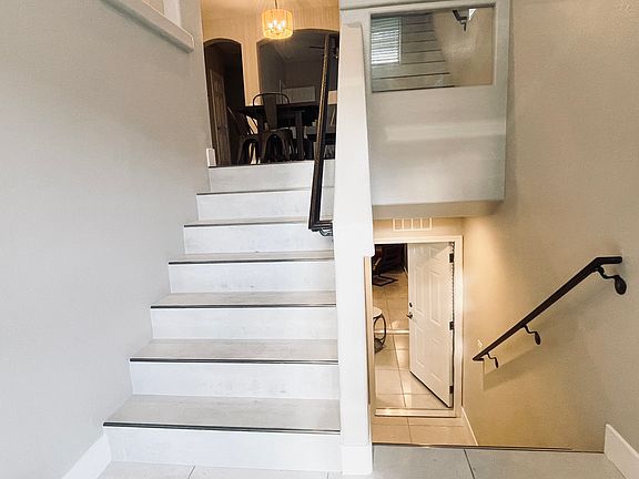 Walk up the stairs to the kitchen or down to a master suite & laundry room