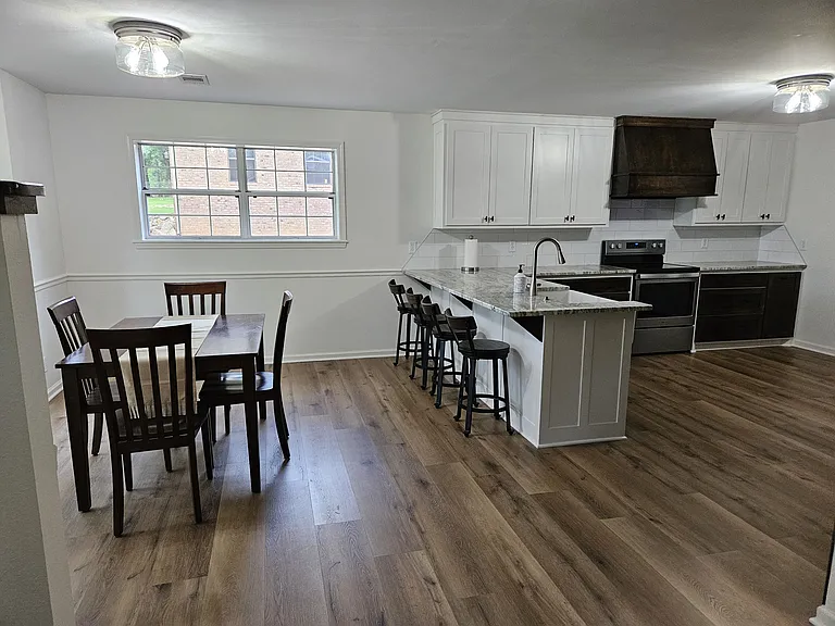 Dinning room and remodeled kitchen with breakfast bar.