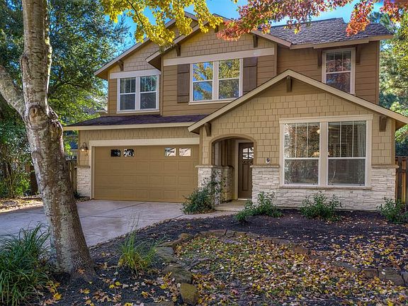 Welcome to 15 Forest Perch Place. You'll find it nestled among towering trees, on a cul-de-sac street and backing to a natural reserve.