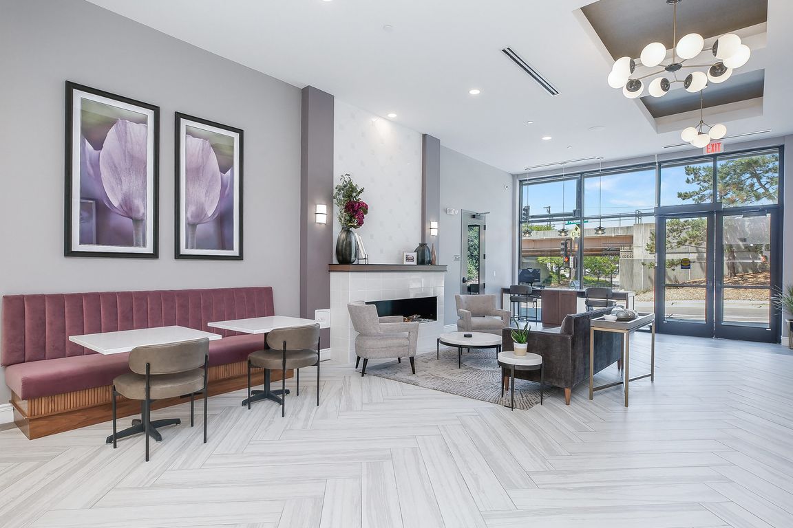 Hotel Style lobby with complimentary coffee bar, fireplace, seating and computer/printer