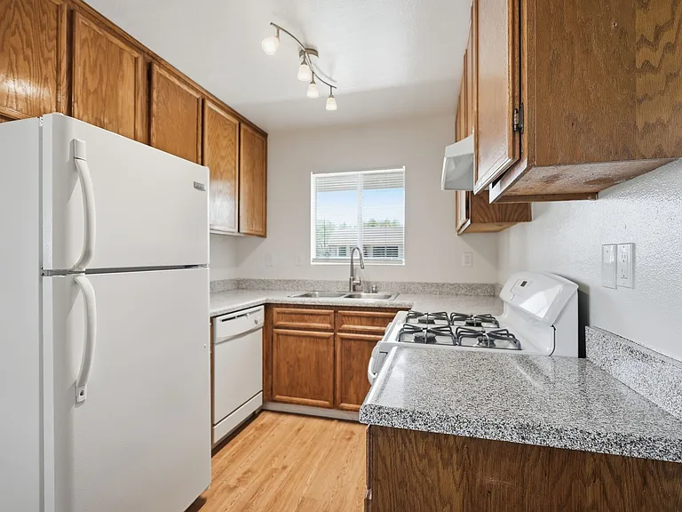 Fully equipped kitchen with gas range.
