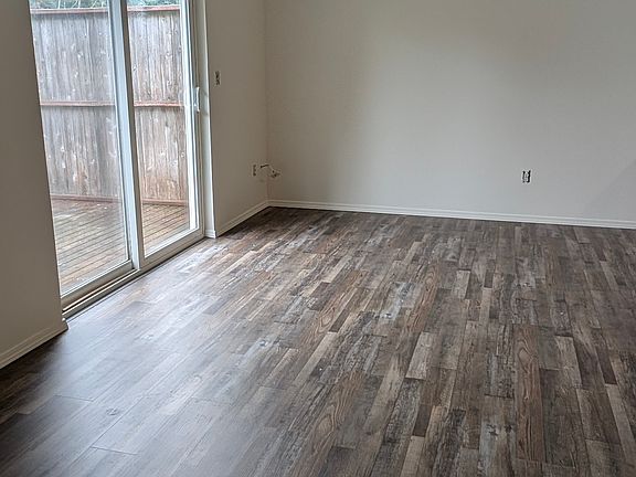New laminate flooring in living and dining area.