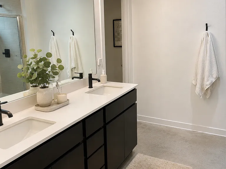 Master bathroom with dual sinks connected to master suite downstairs