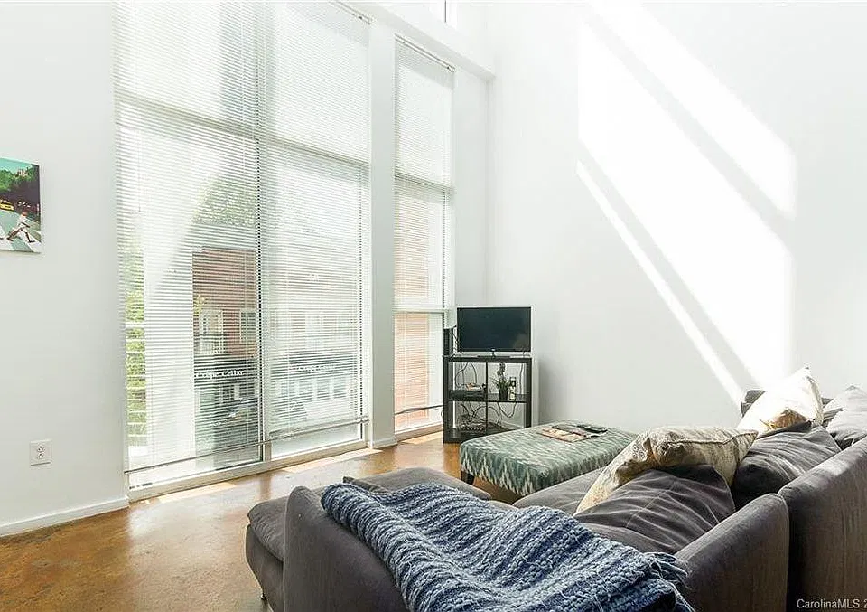 Lots of natural light beams into these 20' ceilings and blinds as well for darkness and privacy when necessary.