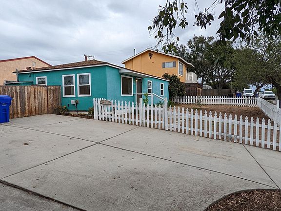Shot of the front yard and open space around houses can be seen.