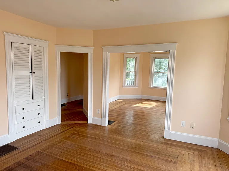 Dining Room with Hutch. Freshly painted throughout whole apartment. Not yet cleaned after the painters. Will be professionally cleaned.