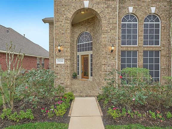 Your guests will be welcomed through the leaded glass front entrance door with covered patio. Side light windows and transoms surround the front door and provide tons of natural light. Nice curb appeal!